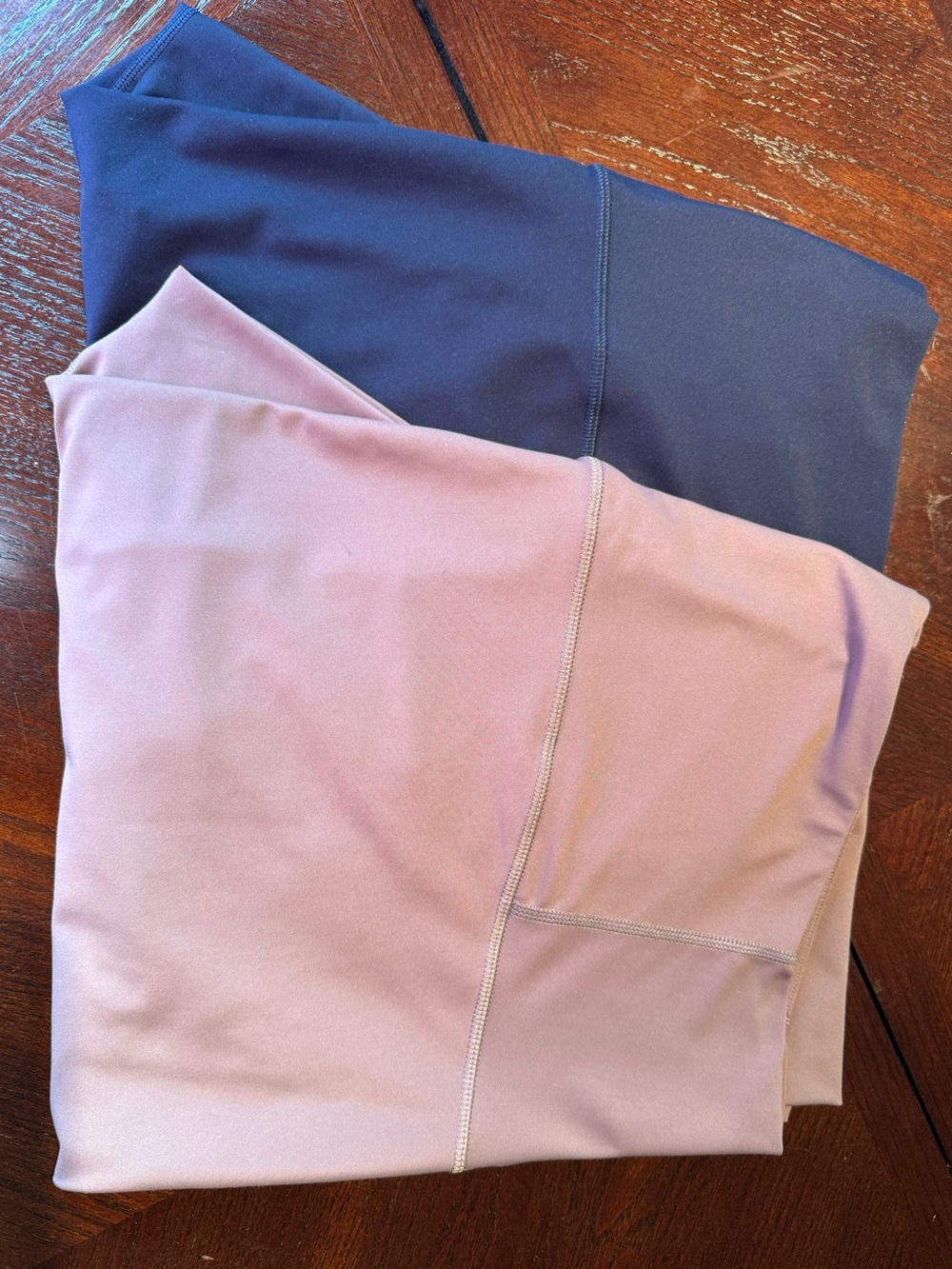 Pair of Old Navy Women’s Powersoft Leggings in Mauve Pink and Navy hidden pocket